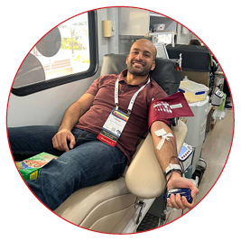 Arman donating blood at the conference, a reminder that saving lives goes beyond engineering and policy.